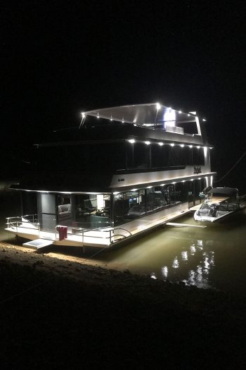 The Houseboat Factory Zivjeli lights on at Night
